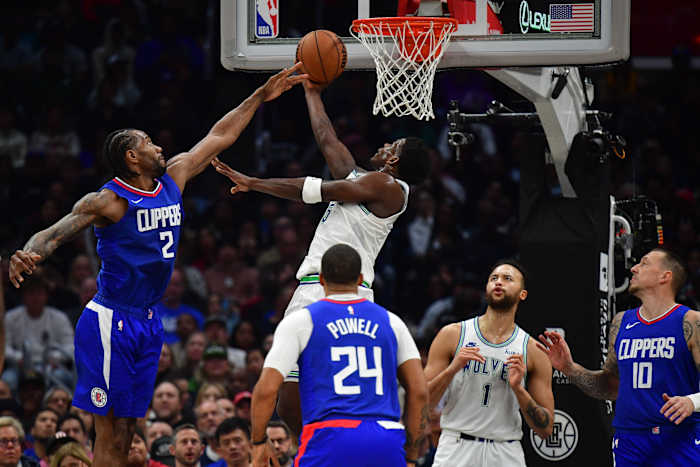 Feb 12, 2024; Los Angeles, California, USA; Minnesota Timberwolves guard Anthony Edwards (5) moves to the basket against the defense of Los Angeles Clippers forward Kawhi Leonard (2) during the second half at Crypto.com Arena.